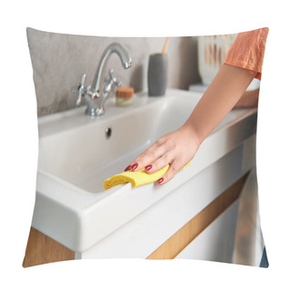 Personality  A Stylish Woman In Casual Attire Diligently Scrubs A Sink With A Bright Yellow Sponge To Remove Dirt And Achieve A Spotless Shine. Pillow Covers