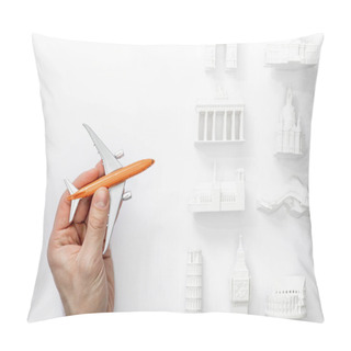 Personality  Cropped View Of Man Holding Toy Plane Near Statuettes From Different Countries Of Europe Isolated On White  Pillow Covers