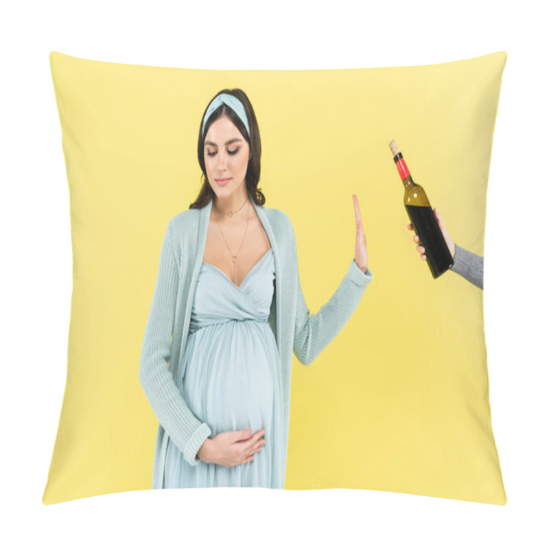 Personality  young pregnant woman refusing from red wine isolated on yellow pillow covers