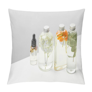 Personality  Organic Beauty Products In Transparent Bottles With Herbs, Leaves And Wildflowers Isolated On Grey  Pillow Covers