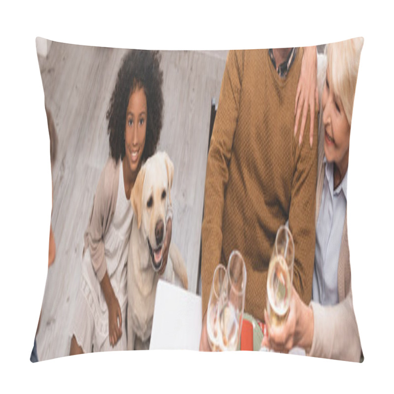 Personality  selective focus of african american girl and golden retriever near family clinking wine glasses on thanksgiving day, panoramic shot pillow covers