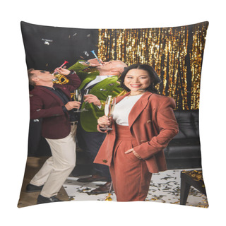 Personality  Asian Woman With Champagne Looking At Camera Near Friends With Party Horn During New Year Party On Black Background  Pillow Covers