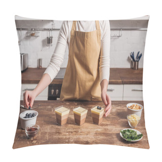 Personality  Cropped Shot Of Woman In Apron Preparing Triple Chocolate Mousse With Blueberries In Glasses  Pillow Covers