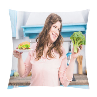 Personality  Portrait Of Overweight Woman With Burger And Fresh Broccoli In Hands In Kitchen At Home, Healthy Eating Concept Pillow Covers