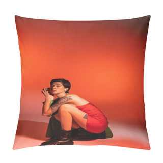 Personality  Trendy Tattooed Woman In Red Strapless Dress And Black Leather Boots Posing On Haunches On Orange Background Pillow Covers