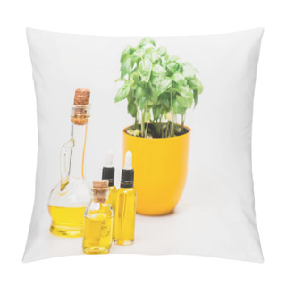 Personality  Selective Focus Of Green Plant In Flowerpot Near Essential Oil In Glass Bottles On White Background, Naturopathy Concept Pillow Covers