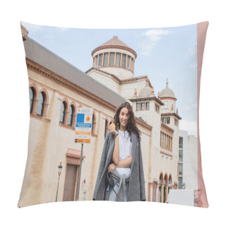 Personality  Smiling And Brunette Woman In Casual Jacket Holding Fresh Orange And Leash While Standing Near Blurred Historic Landmark On Urban Street In Barcelona, Spain, Ancient Building Pillow Covers