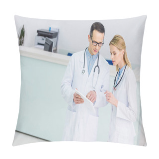 Personality  Two Doctors In White Coats With Tablet Discussing Diagnosis In Clinic Pillow Covers