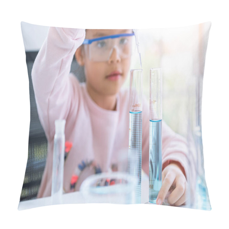 Personality  Asian little girl holding and dropping blue solution in test tub pillow covers