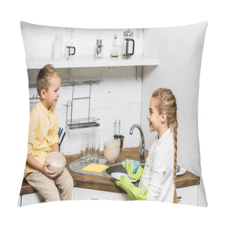 Personality  Cute Girl In Rubber Gloves Washing Dishes And Looking At Smiling Boy Sitting On Table And Holding Bowl In Kitchen Pillow Covers