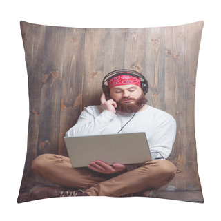 Personality  In The Rhythm Of My Music. Relaxed Young Bearded Man In Headphones Using Laptop Leaning On Wooden Wall And Listening To The Music. Pillow Covers