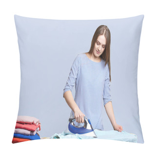 Personality  Beautiful Brunette Housewife Irons Clothes On Ironing Boards, Peals It Neatly, Being Busy All Day Long, Does Domestic Work, Isolated Over Blue Background. Woman With Electric Iron. Housework Concept Pillow Covers