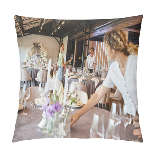 Personality  Blurred Woman Arranging Festive Table Setting Near Smiling Team Working In Modern Event Hall Pillow Covers