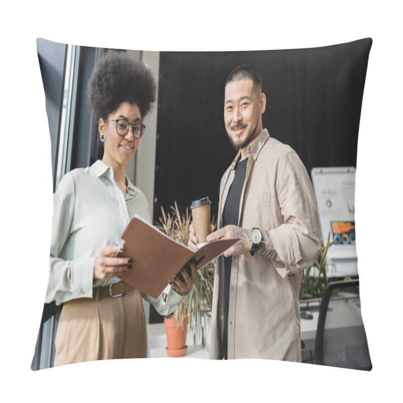 Personality  asian businessman with coffee and african american businesswoman looking at camera in office pillow covers