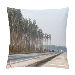 Personality  LVIV, UKRAINE - OCTOBER 23, 2019: Roadwork Cones Near Highway With Car Moving With Lighting Headlamps In Ukraine Pillow Covers