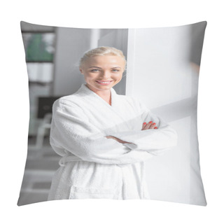 Personality  Attractive Smiling Adult Woman In White Bathrobe With Arms Crossed Standing Near Window Pillow Covers
