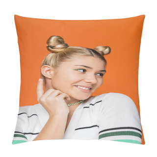 Personality  Portrait Of Smiling And Trendy Blonde Teen Girl With Hairstyle And Bold Makeup Pointing With Finger And Looking Away While Standing Isolated On Orange, Trendy Teenage Girl Expressing Individuality Pillow Covers
