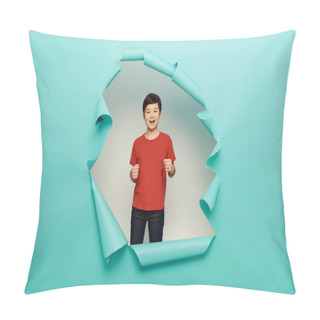 Personality  Cheerful Asian Preteen Boy In Red T-shirt Dancing And Looking At Camera During Child Protection Day Celebration Behind Hole In Blue Paper White Background Pillow Covers