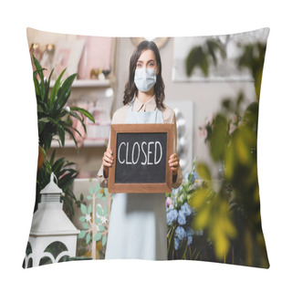 Personality  Young Florist In Medical Mask Holding Board With Closed Lettering Near Plants On Blurred Foreground Pillow Covers