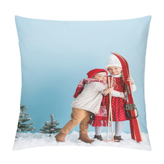 Personality  Kid In Hat And Scarf Hugging Sister With Ski Poles And Skis While Standing On Blue Pillow Covers