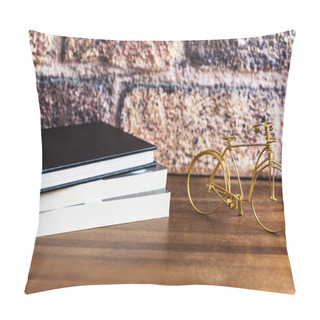 Personality  Three Books On The Wooden Shelf With A Golden Bike Pillow Covers