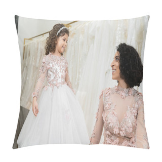Personality  Joyful Middle Eastern Woman With Wavy Hair Looking At Cute Girl And Smiling Near White Wedding Dresses In Bridal Salon, Floral, Mother And Daughter, Happiness, Wedding Day, Shopping Pillow Covers