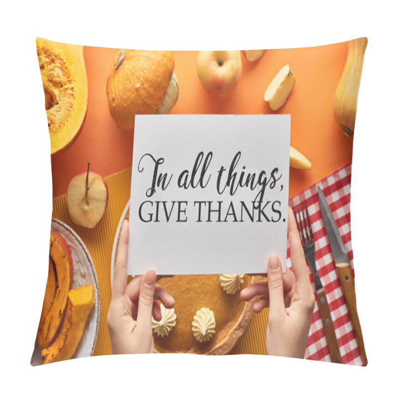 Personality  cropped view of woman holding card with in all things give thanks illustration near pumpkin pie on orange background pillow covers