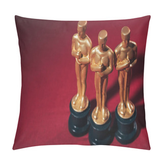 Personality KYIV, UKRAINE - JANUARY 10, 2019: Selective Focus Of Golden Oscar Award Statuettes On Red Background With Copy Space Pillow Covers