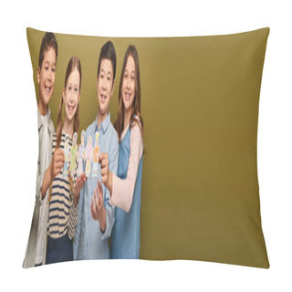 Personality  Happy Interracial Preteen Friends In Casual Clothes Holding Drawn Paper Craft Characters And Looking At Camera During Child Protection Day Celebration On Khaki Background With Copy Space, Banner  Pillow Covers