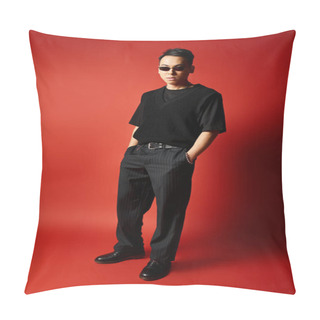 Personality  A Stylish And Handsome Asian Man In Black Attire Striking A Pose In Front Of A Vivid Red Background In A Studio Setting. Pillow Covers