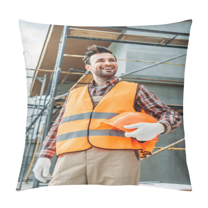 Personality  Happy Builder In Reflective Vest Holding Helmet While Standing In Front Of Building House And Looking Away Pillow Covers