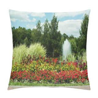 Personality  Red Blooming Flowers Near Plants And Fountain Against Blue Sky  Pillow Covers