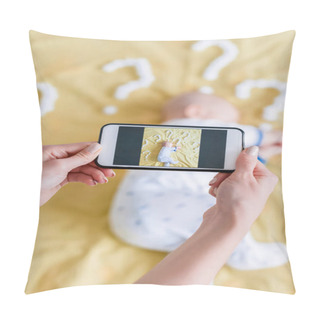 Personality  Cropped Shot Of Mother Taking Top View Photo With Smartphone Of Child Sleeping In Bed Surrounded With Question Marks Pillow Covers