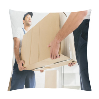Personality  Low Angle View Of Multiethnic Movers In Uniform Carrying Huge Carton Box  Pillow Covers