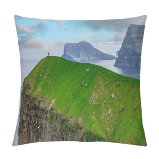 Personality  Unknown Man Stands On Top Of The Grassy Hill While Birds Fly Over The Vibrant Green Fjord In Faroe Islands. Beautiful Shot Of The Wild Scandinavian Shoreline With Towering Cliffs And Tranquil Ocean. Pillow Covers