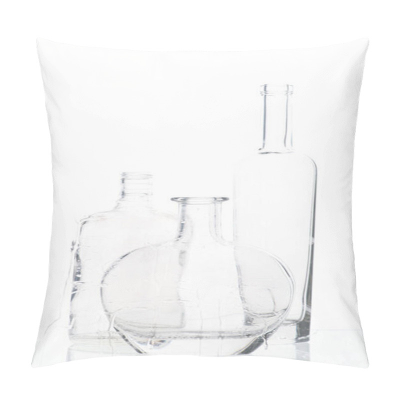 Personality  composition from empty alcoholic bottles through glass with water drops against white background pillow covers