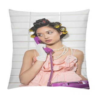 Personality  Brunette And Asian Young Woman With Hair Curlers Standing In Pink Ruffled Top, Pearl Necklace And White Gloves And Talking On Purple Retro Phone Near White Tiles, Housewife, Looking Away  Pillow Covers