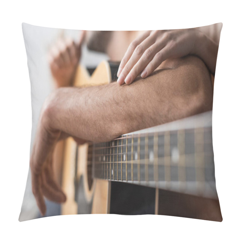 Personality  Cropped view of woman touching arm of boyfriend near acoustic guitar  pillow covers