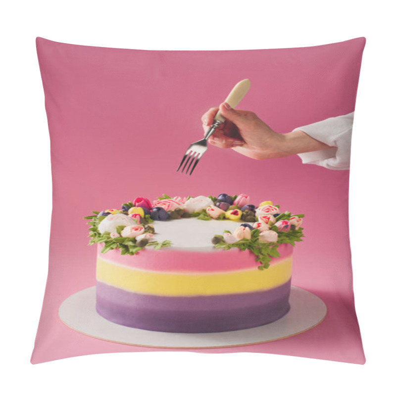 Personality  cropped shot of woman with fork and sweet cake decorated with flowers isolated on pink pillow covers