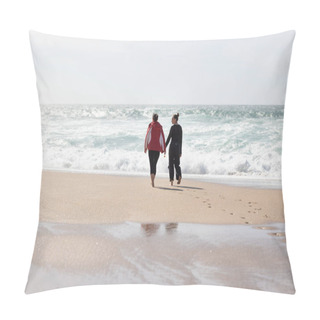 Personality  A Pair Of Individuals, Likely Friends, Strolling Along The Sandy Beach While Interlocking Hands. The Two Figures Are Engaged In A Shared Activity, Enjoying The Seaside Atmosphere. Pillow Covers