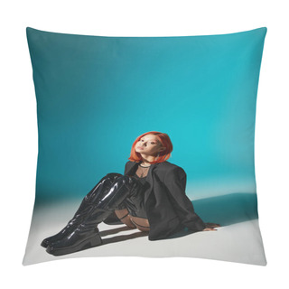 Personality  Asian Woman With Nose Piercing Sitting In Oversized Blazer And Black Latex Boots On Blue Backdrop Pillow Covers