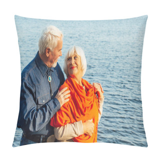 Personality  Cheerful Senior Citizens Woman And Man Are Standing And Hugging On The Lake, Against The Background Of The Bridge. Pillow Covers