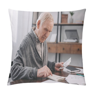 Personality  Senior Man Sitting At Table With Paperwork And Using Calculator While Counting Money  Pillow Covers