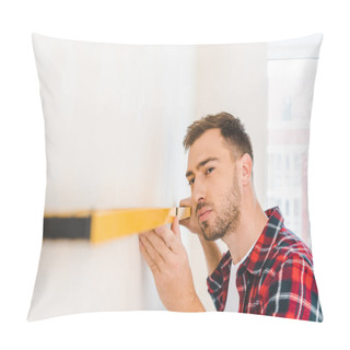 Personality  Handsome Handyman Holding Measuring Level While Measuring Wall At Home Pillow Covers