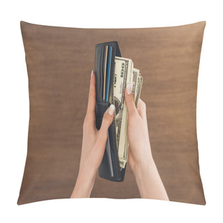 Personality  Top View Of Woman Puting Dollars Banknotes In Wallet On Wooden Background Pillow Covers
