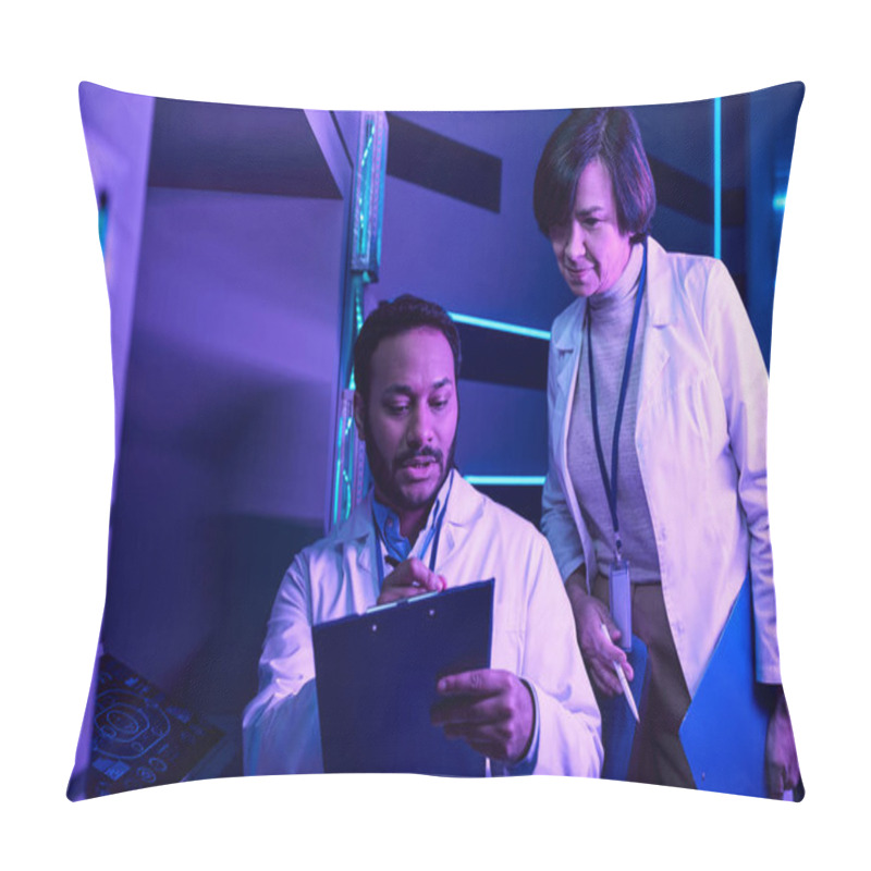 Personality  Hindu Male And Adult Female Scientists Analyze Data In Neon-Lit Science Center Pillow Covers