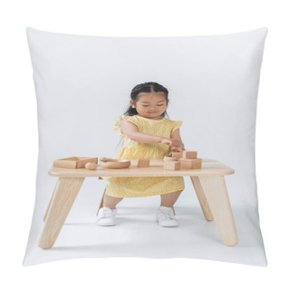 Personality  Full Length Of Asian Child Playing With Wooden Toys On Table On Grey Pillow Covers