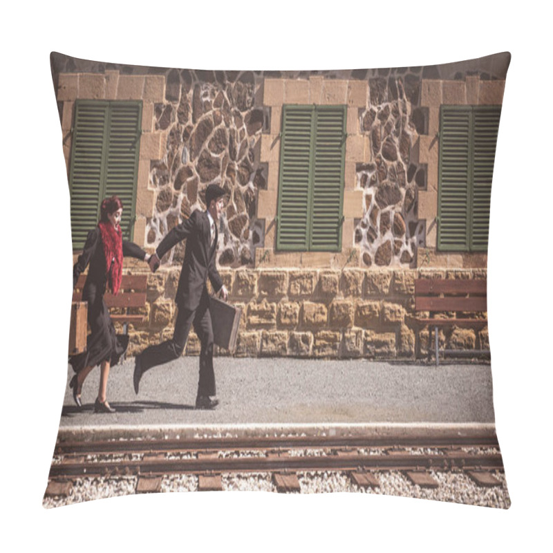 Personality  Young couple with vintage suitcase running fast outside a train station to catch the last train for journey. pillow covers