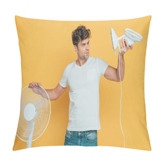 Personality  Concentrated And Worried Man Looking At Desk Fan Isolated On Yellow Pillow Covers