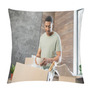 Personality  Joyful African American Man Holding Plate While Unpacking Cardboard Boxes In New House Pillow Covers